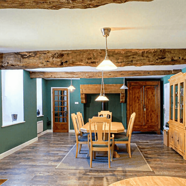 Beautiful interior of a Brittany gite with wooden beams and modern furnishings.