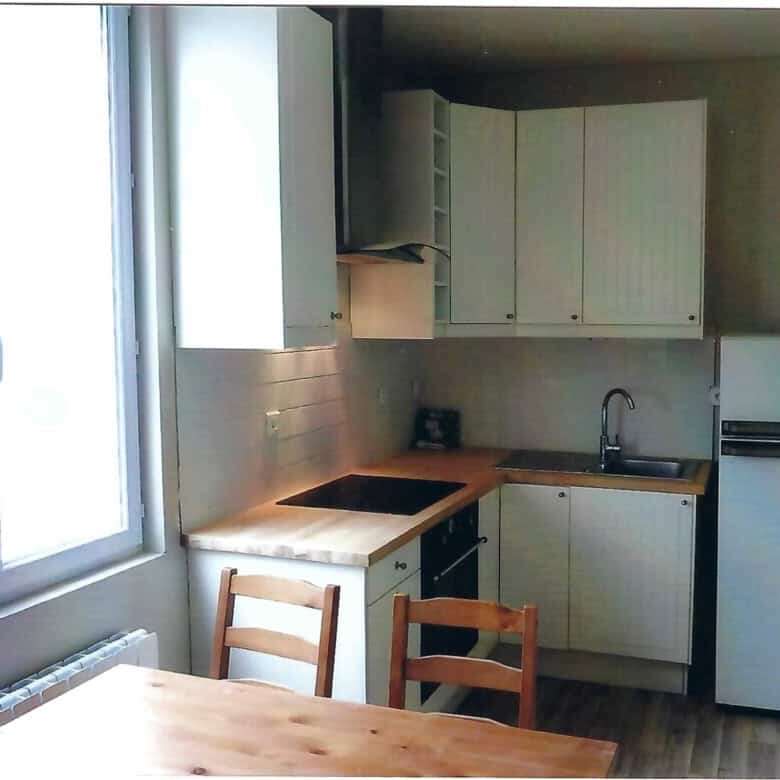 Bright kitchen in seaside house with 5 apartments for sale in Mers Les Bains, featuring modern cabin.
