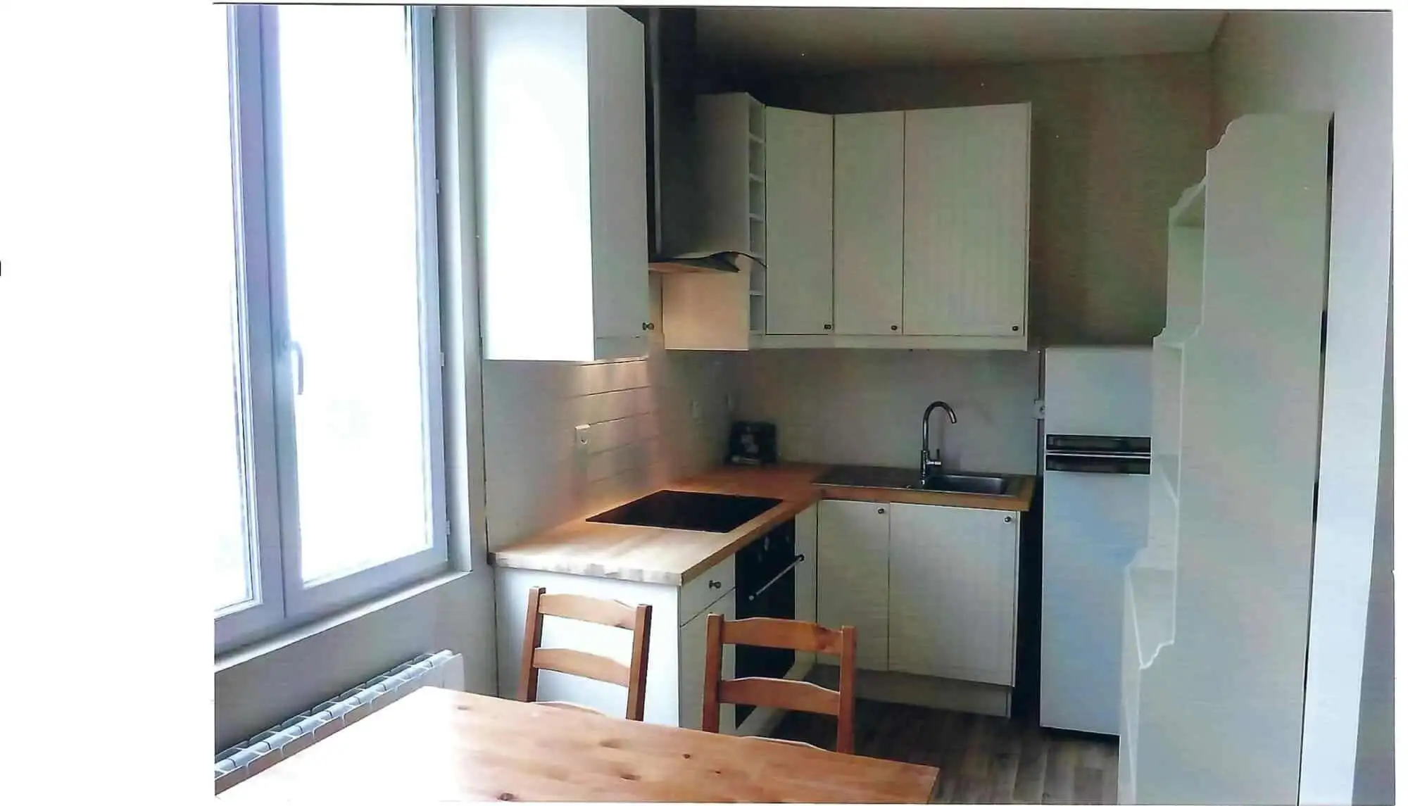 Bright kitchen in seaside house with 5 apartments for sale in Mers Les Bains, featuring modern cabin.