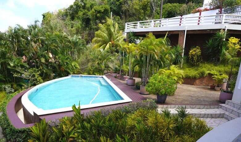 Poolside view of a luxury 5-bedroom villa in Harmony Hall, Prospect, St. Vincent.
