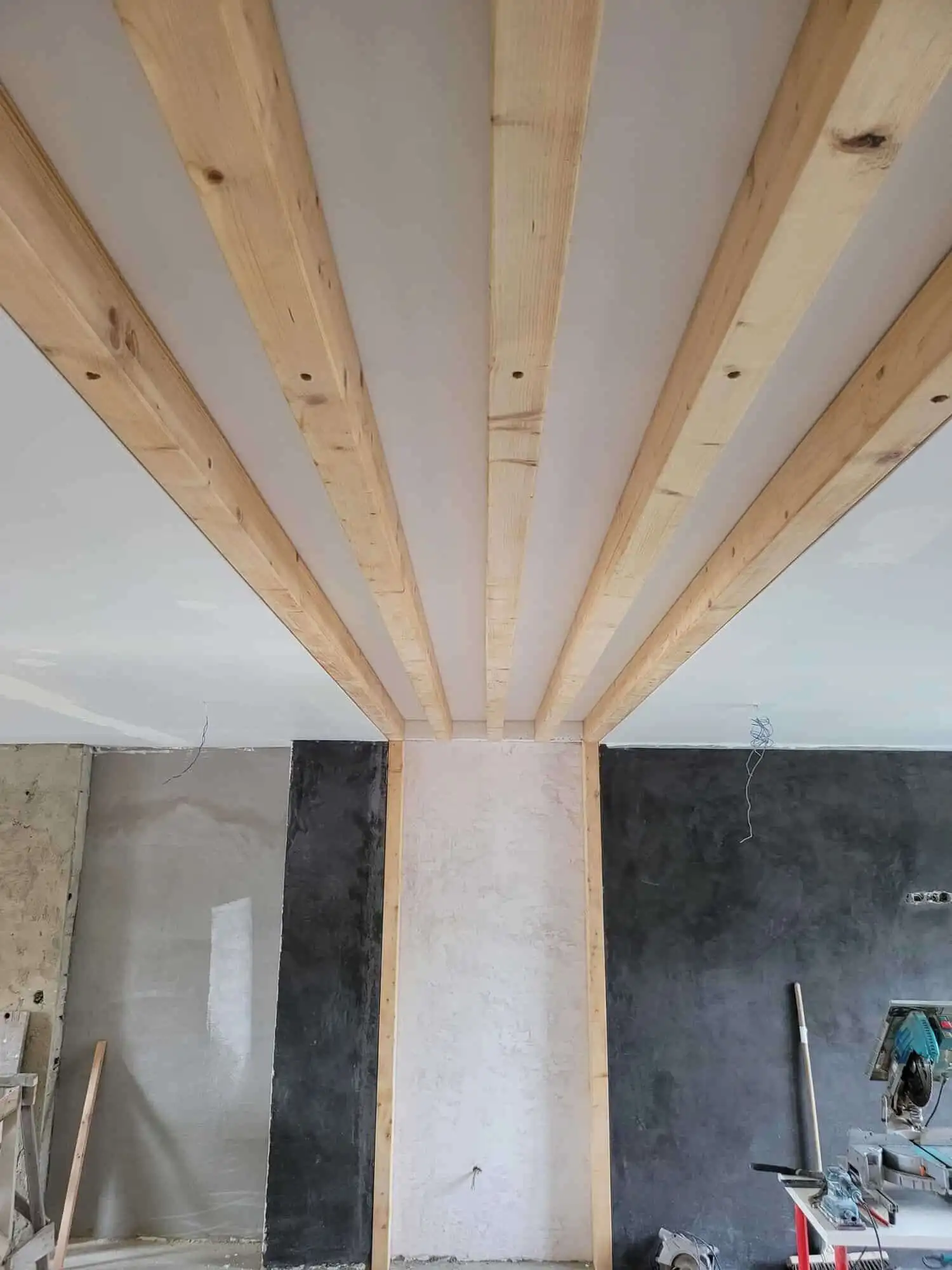 Ceiling framework with wooden beams in a luxury villa under construction.