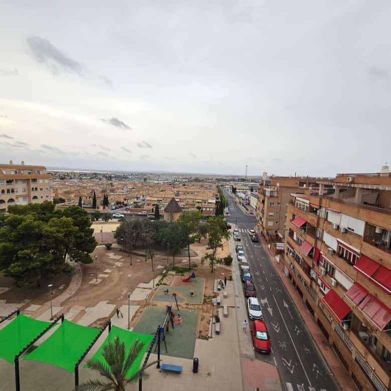 Modern 2-bedroom penthouse apartment with panoramic city views in Torrevieja, Spain.