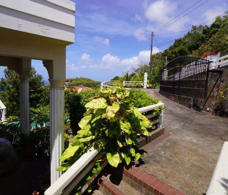 Villa with lush greenery and scenic views in Prospect, St. Vincent.