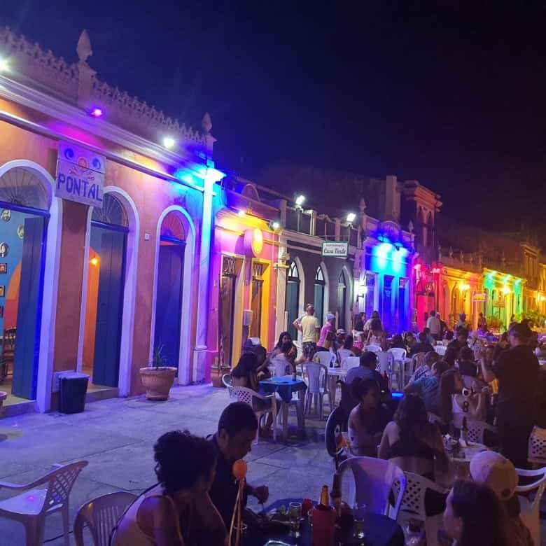 Brightly lit colonial houses in Bahia at night.