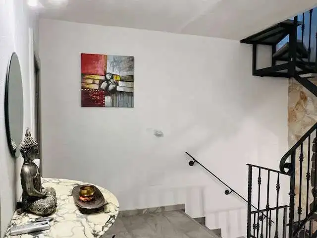 Beautiful interior of a spacious 3-bedroom house in Chiaramonti, Sardinia, featuring modern decor an.