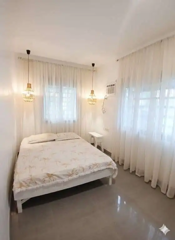 Bright 3-bedroom house for sale in Siargao Island with natural light and modern decor. Perfect for r.