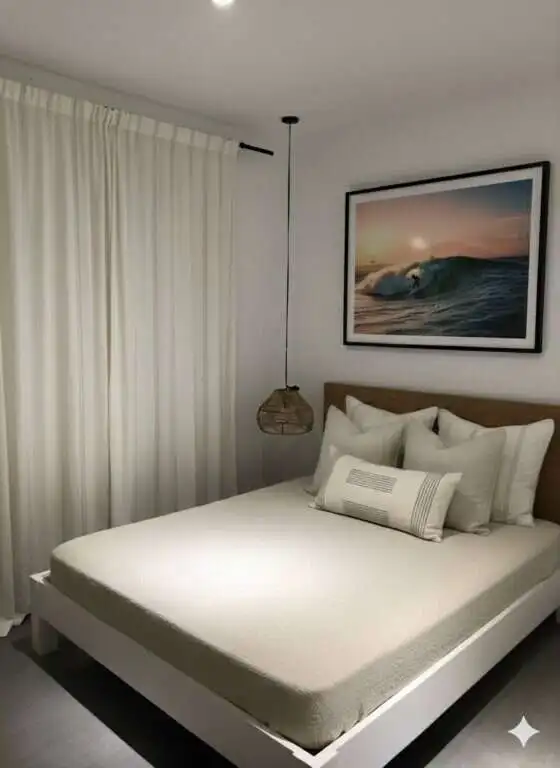 Cozy bedroom featuring ocean view and minimalist decor in Siargao Island home.