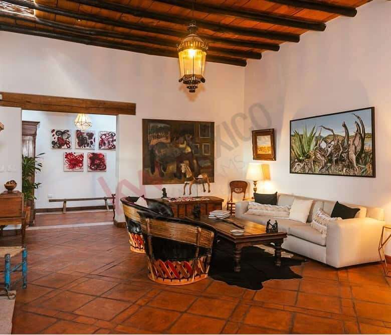 Style living room featuring traditional wooden beams and artwork, offering stunning views of Allende.