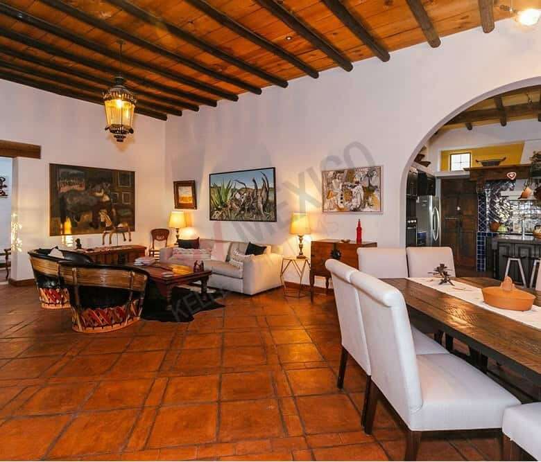 Elegant colonial estate interior with traditional wooden ceiling and cozy lighting.
