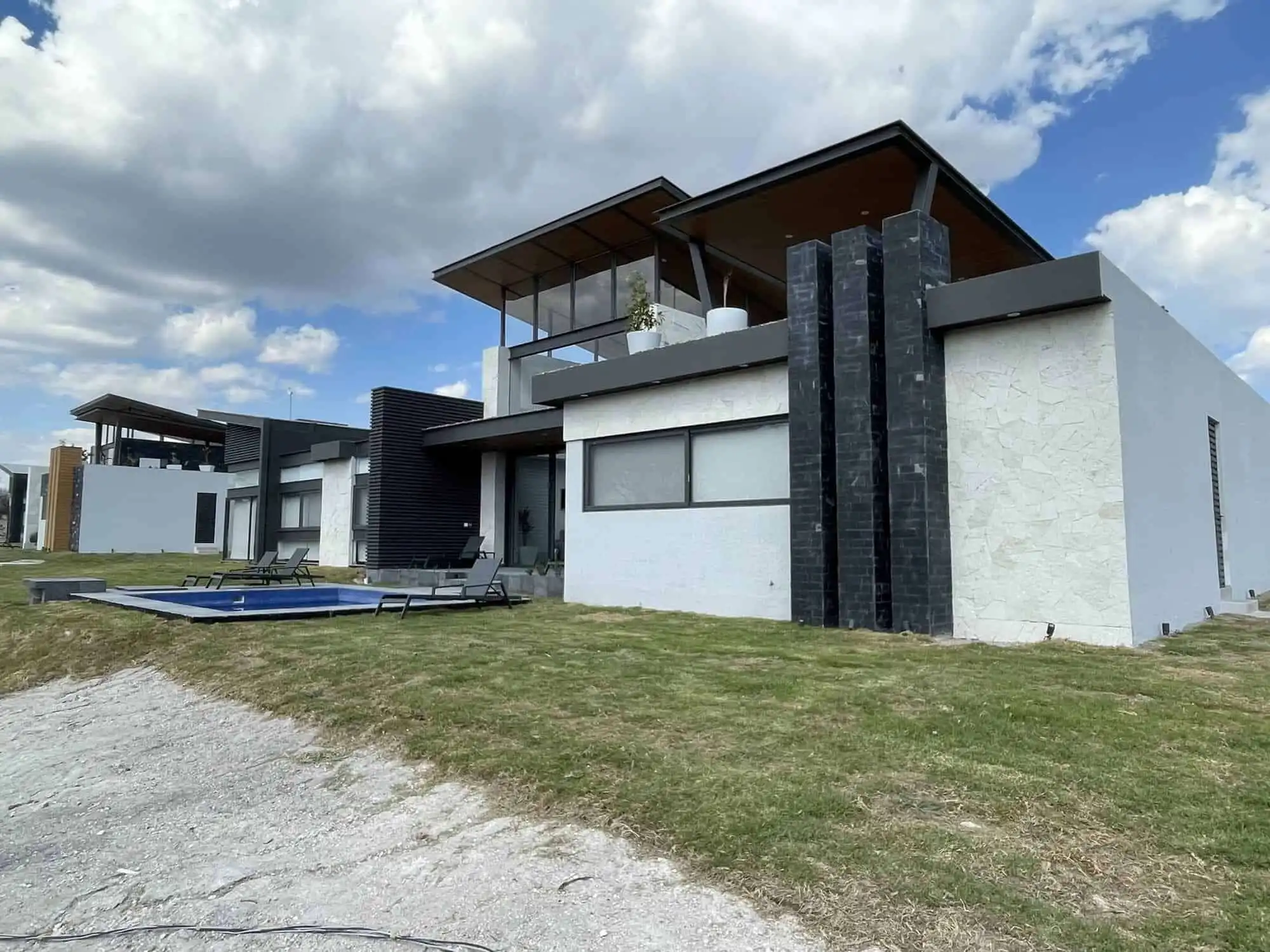 Elegant contemporary home with rooftop views, private pool, and spacious outdoor areas in a scenic v.
