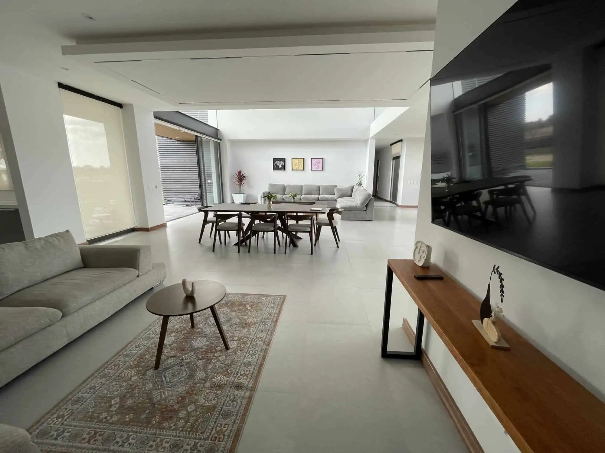 Spacious modern living room with elegant furniture and large windows in San Miguel de Allende.