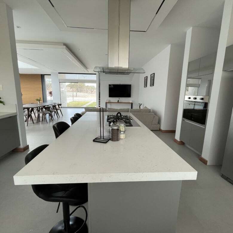 Modern kitchen with island and stainless steel appliances in San Miguel de Allende.