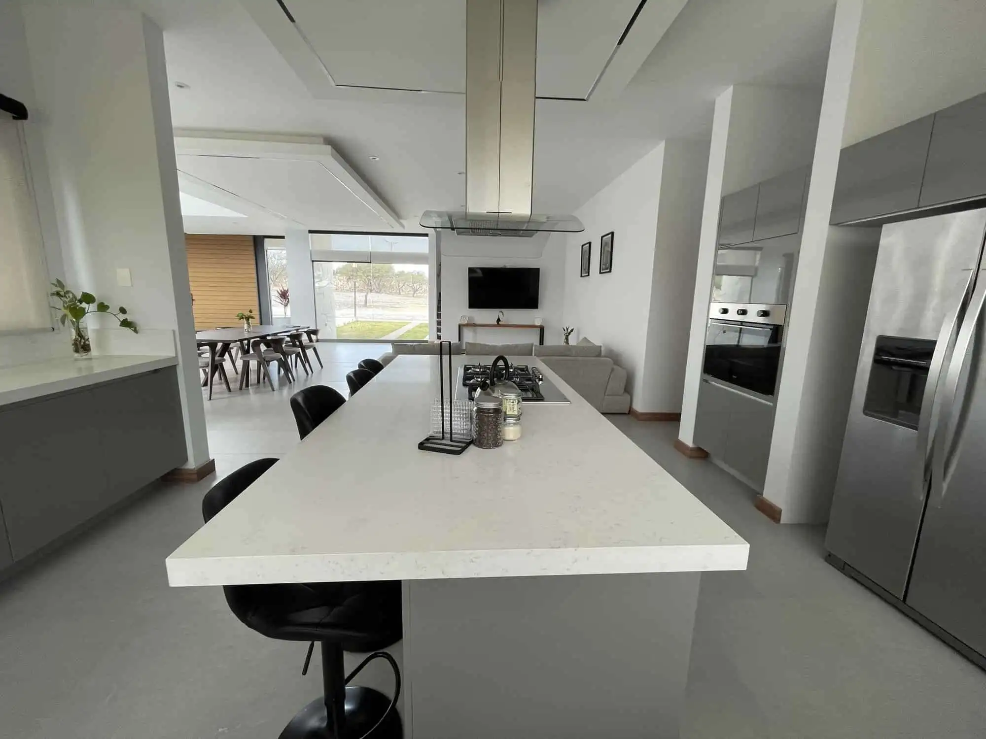 Modern kitchen with island and stainless steel appliances in San Miguel de Allende.