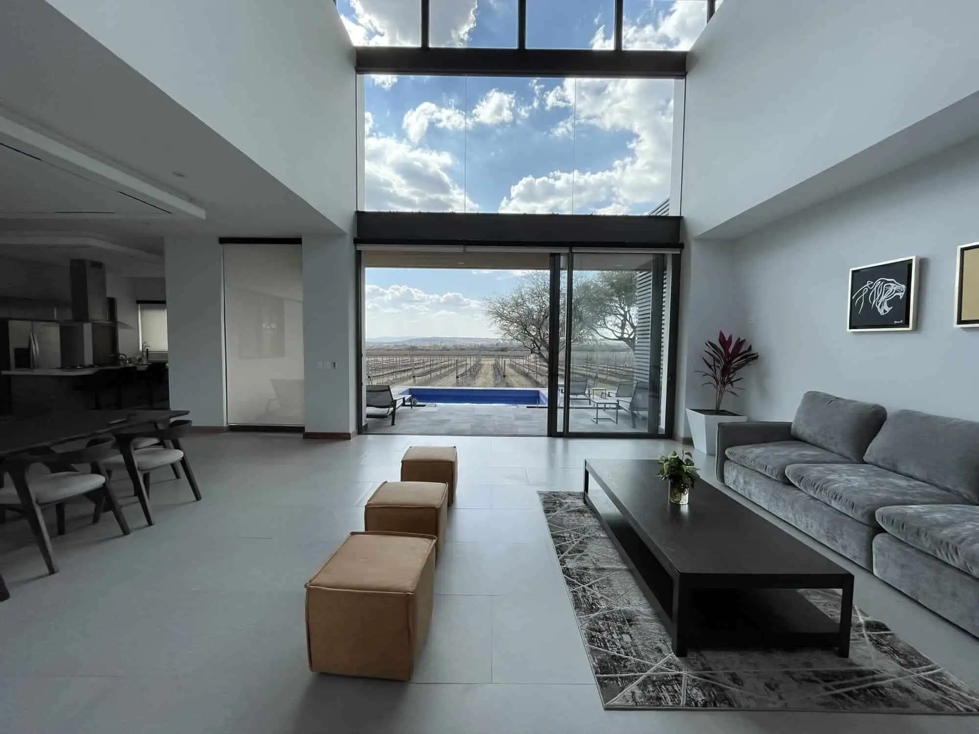 Modern living room with large glass windows and scenic views in San Miguel de Allende.