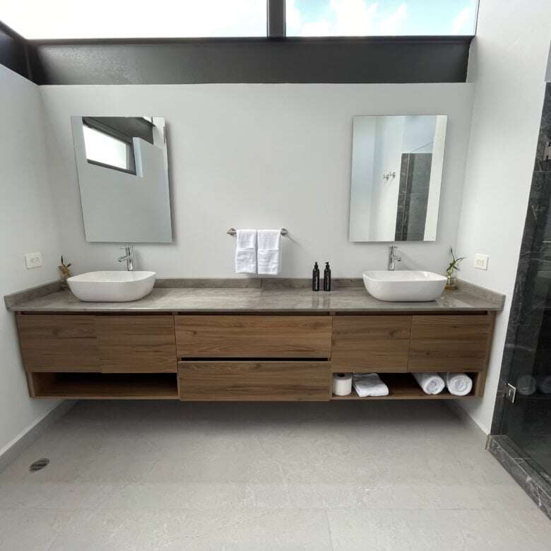 Elegant bathroom with dual vessel sinks and modern fixtures in a luxury vineyard estate.
