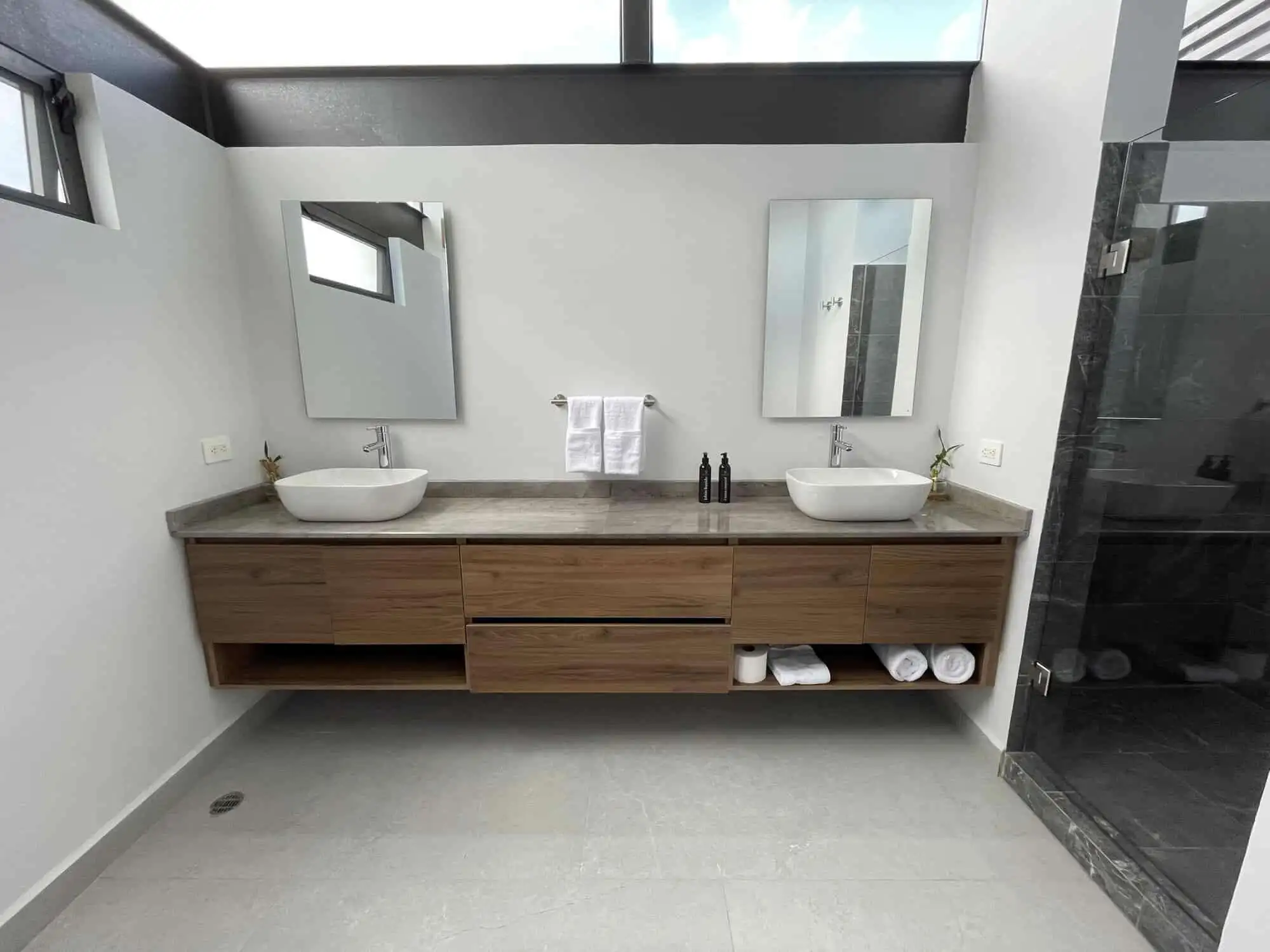 Elegant bathroom with dual vessel sinks and modern fixtures in a luxury vineyard estate.