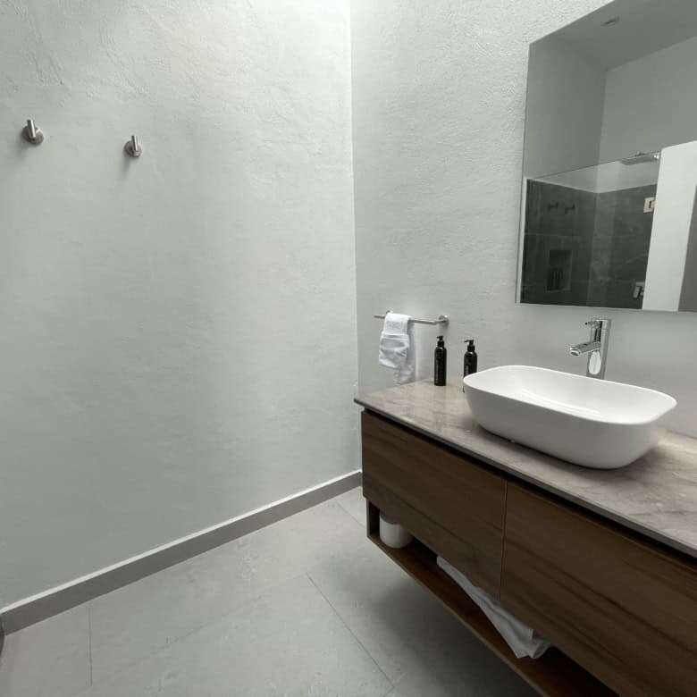 Modern bathroom with minimalist design and sleek fixtures.