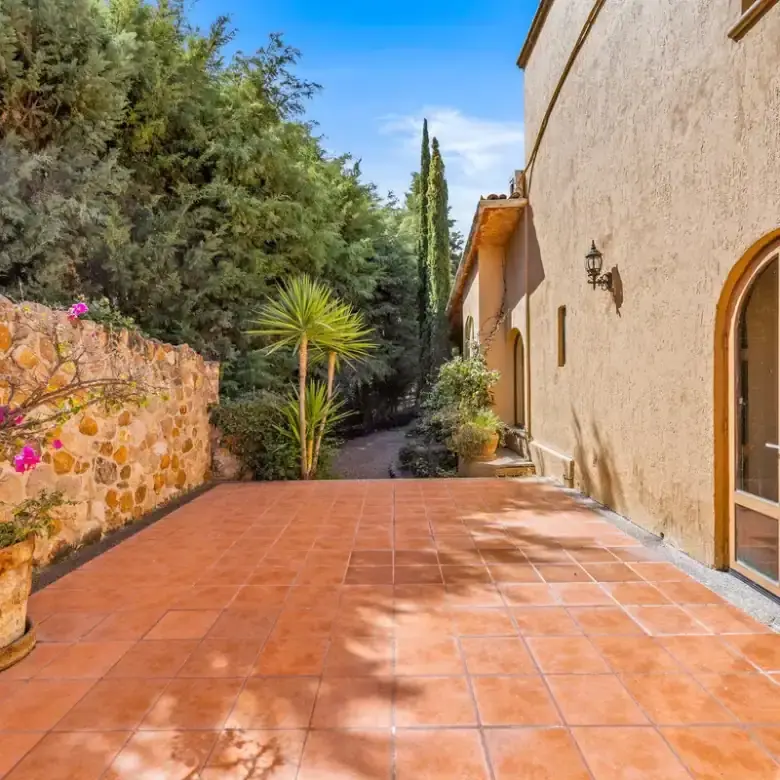 Beautiful lakefront home in Rancho Los Labradores, San Miguel de Allende, with lush greenery and out.
