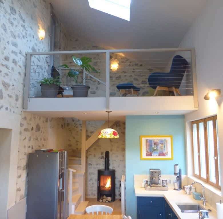Elegant country estate interior with stone walls and modern amenities in Occitanie.