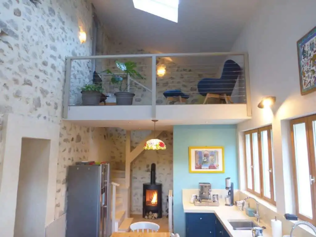 Elegant country estate interior with stone walls and modern amenities in Occitanie.