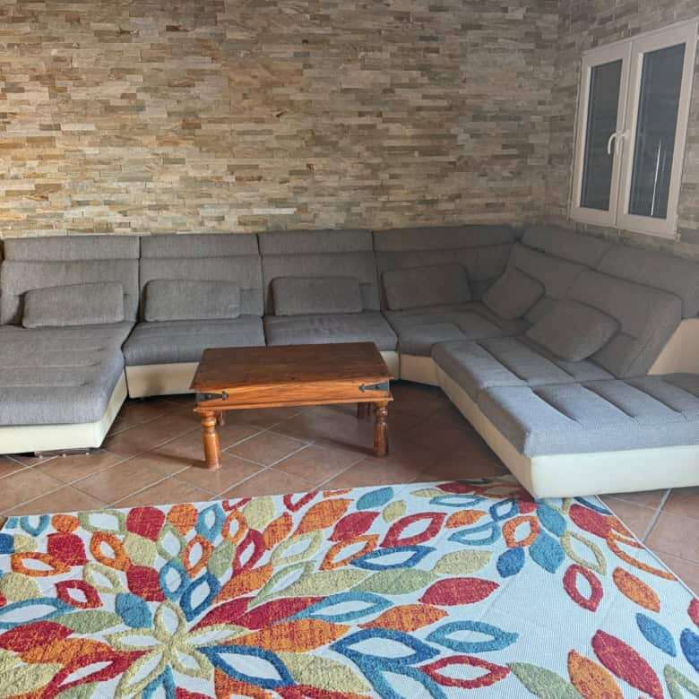 Cozy living room with mountain views in a Swiss chalet. Perfect holiday or rental property with invi.