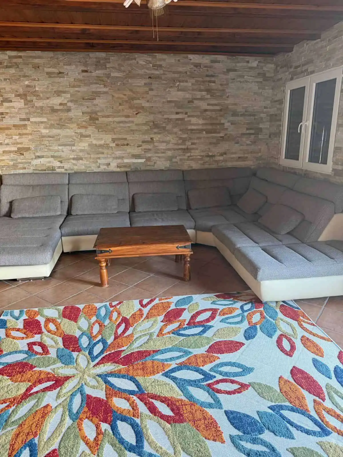 Cozy living room with mountain views in a Swiss chalet. Perfect holiday or rental property with invi.