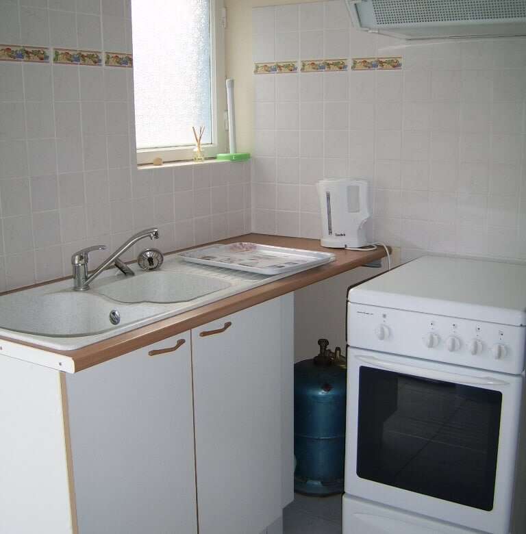 Compact kitchen in seaside house with 5 apartments for sale in Mers Les Bains.