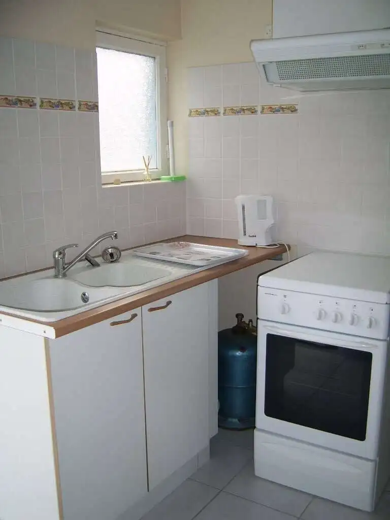 Compact kitchen in seaside house with 5 apartments for sale in Mers Les Bains.