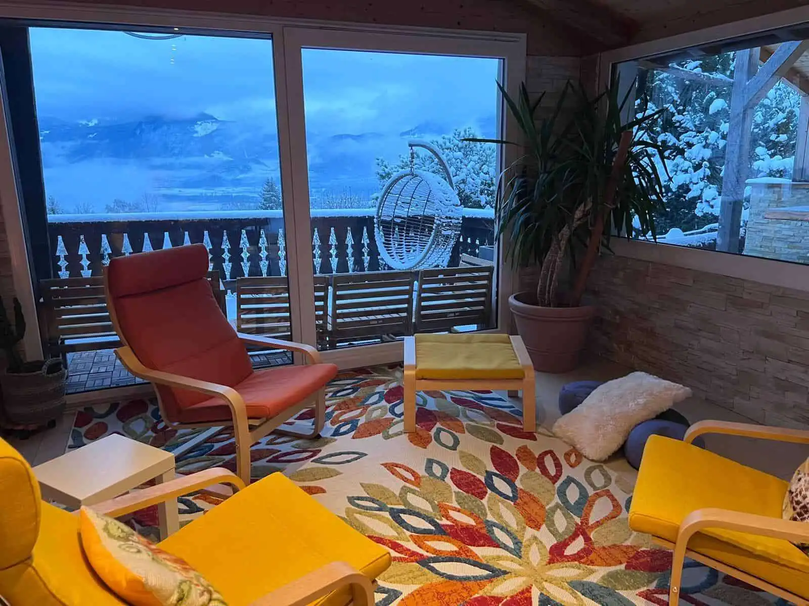 Charming Swiss chalet interior with panoramic mountain views, perfect for holiday or rental investme.