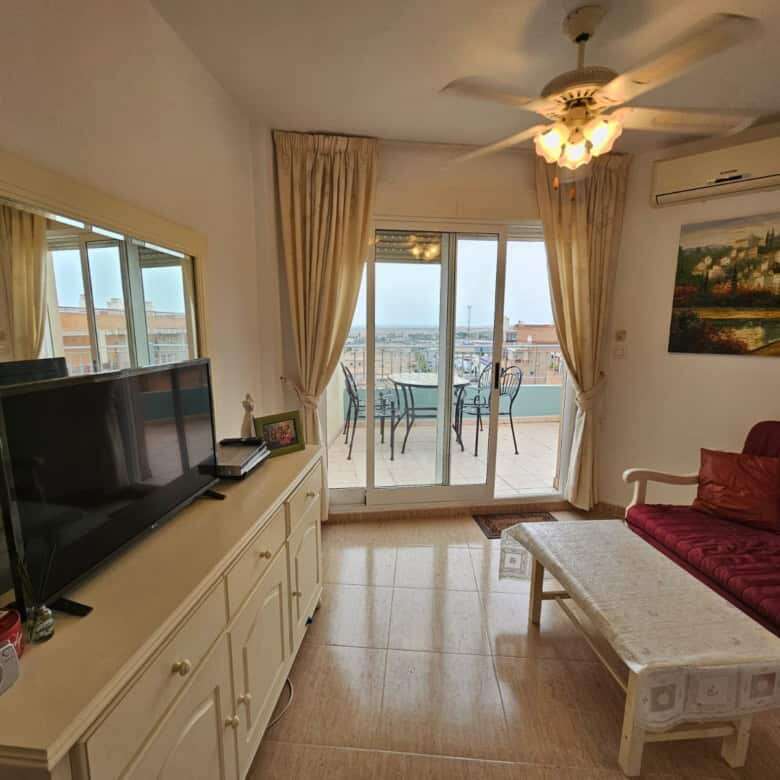 Bright living room with balcony overlooking the sea in Torrevieja.