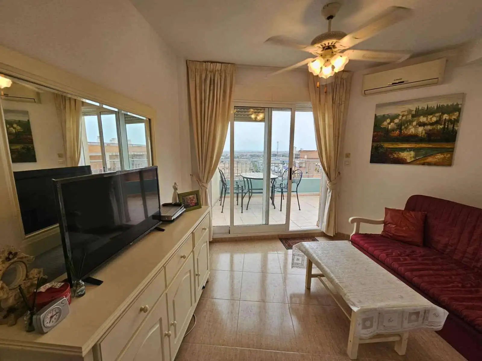 Bright living room with balcony overlooking the sea in Torrevieja.