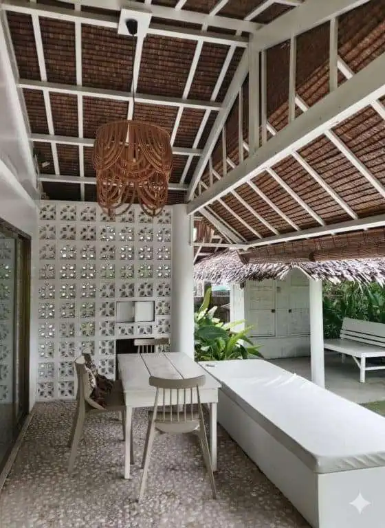 Charming interior of a 3-bedroom house in Siargao Island, featuring a cozy sitting area and tropical.