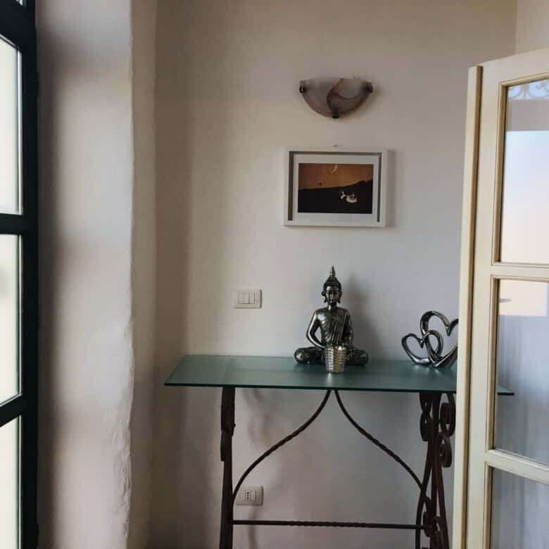 Bright interior of a charming 3-bedroom house in Chiaramonti, Sardinia, featuring a cozy sitting are.