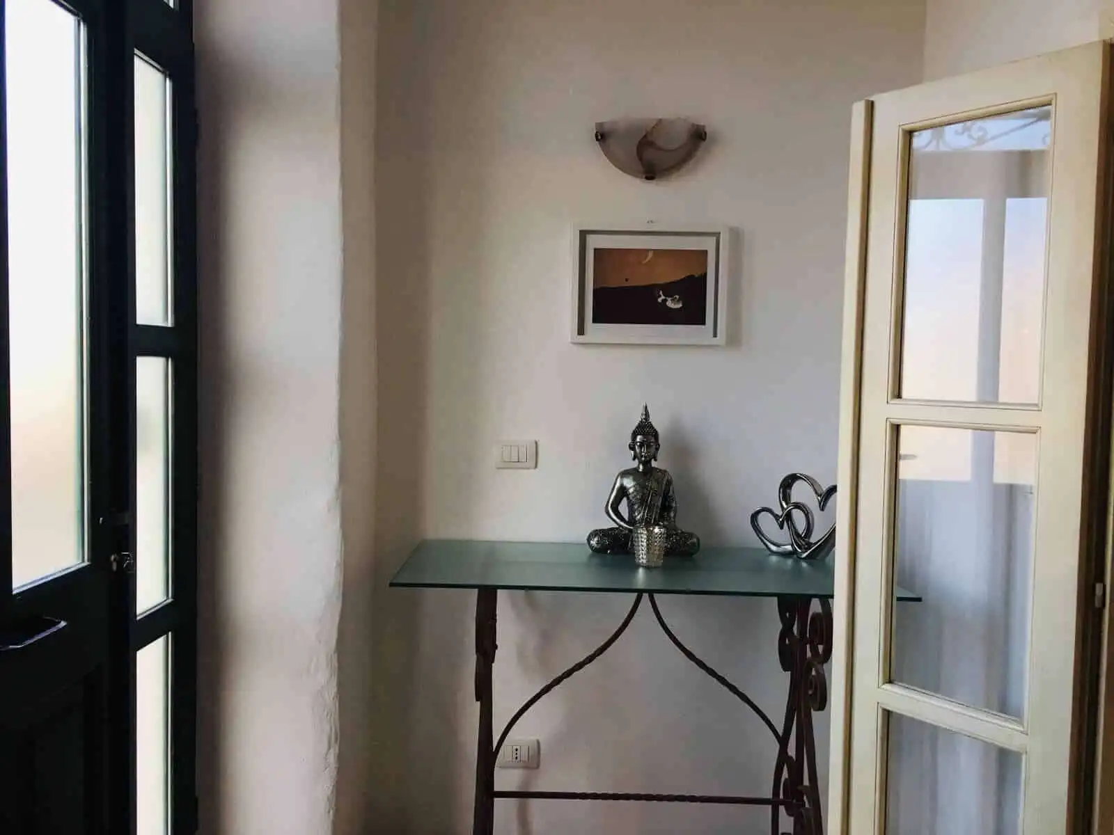 Bright interior of a charming 3-bedroom house in Chiaramonti, Sardinia, featuring a cozy sitting are.