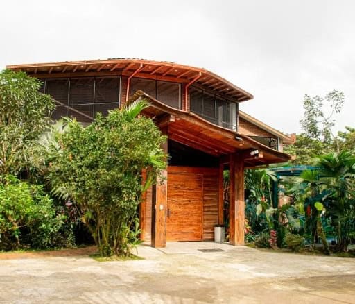 River Retreat House with lush greenery in Llurimagua, Ecuador.