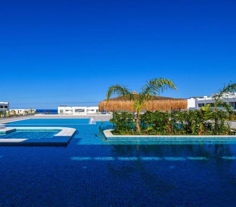 Modern pool area at Deja Blue Complex with ocean view in North Cyprus.