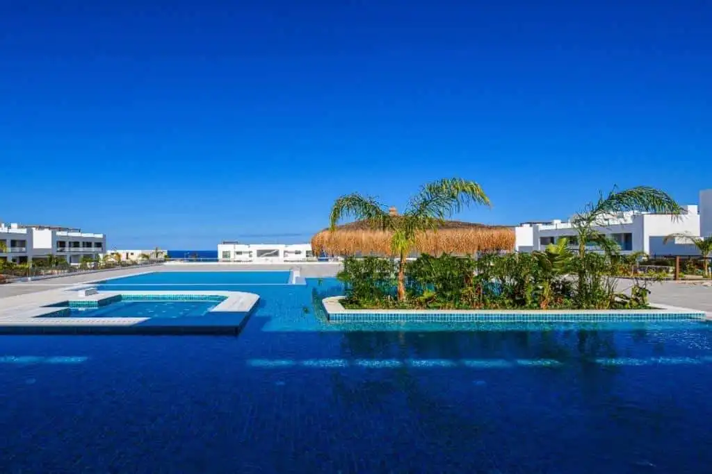 Modern pool area at Deja Blue Complex with ocean view in North Cyprus.