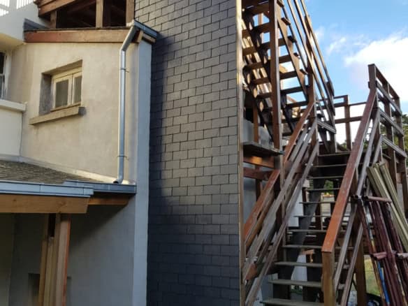 Attic renovation project with external staircase in Penmarch, Brittany, France.