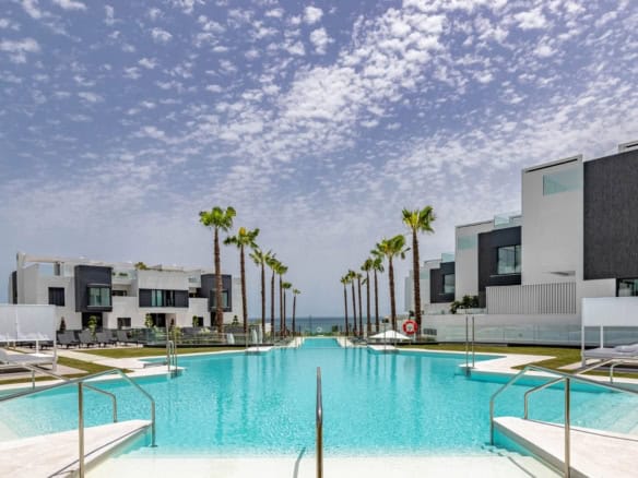 Luxury beachfront townhouse with modern design and stunning sea views in Estepona West.