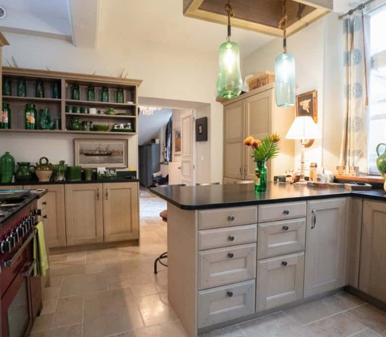 Charming kitchen of a 5-bedroom house for sale in Chateaudun, France, featuring modern appliances an.