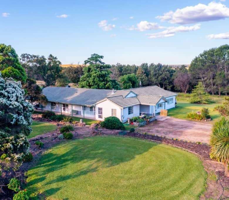 Vineyard estate featuring two stunning homes for sale in Broke, surrounded by lush gardens and sceni.