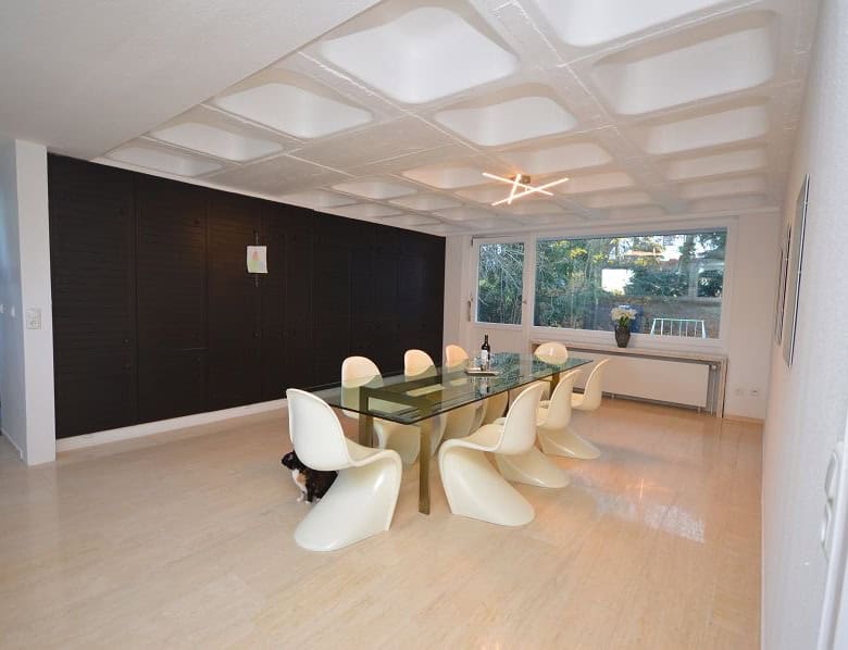 Elegant dining room with modern design and large windows in Bad Harzburg, Niedersachsen, Germany.