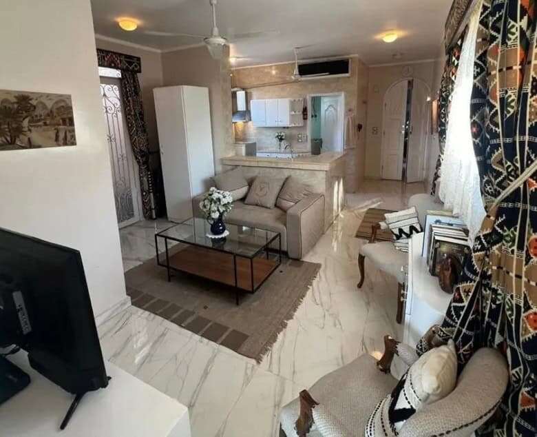 Spacious living room in Derrymore Glen estate with modern furnishings and elegant decor.