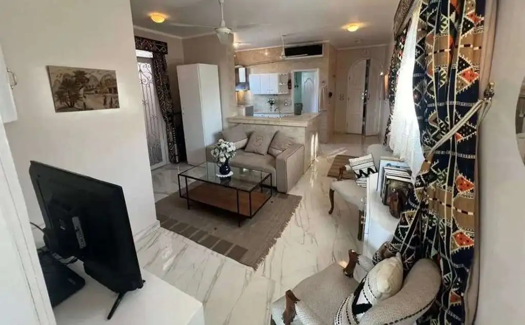 Spacious living room in Derrymore Glen estate with modern furnishings and elegant decor.