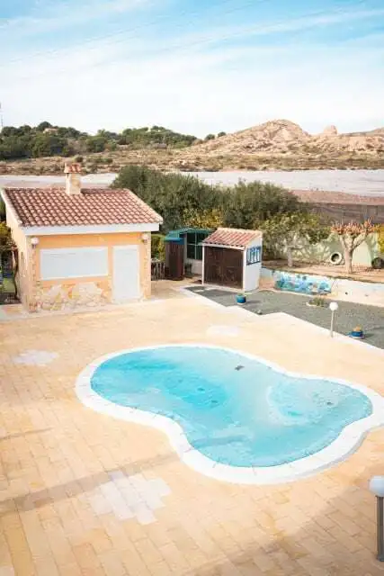 Beautiful 4-bedroom villa with private pool in Totana Murcia, offering spacious living areas and sce.