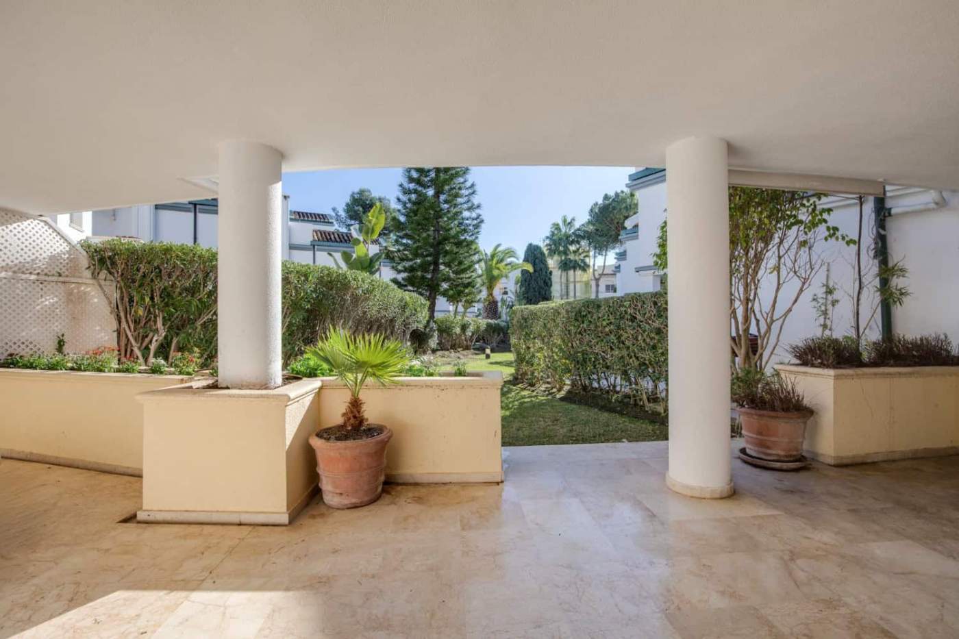 Beachfront view from a luxury property in Dominion Beach with lush gardens and modern architecture.