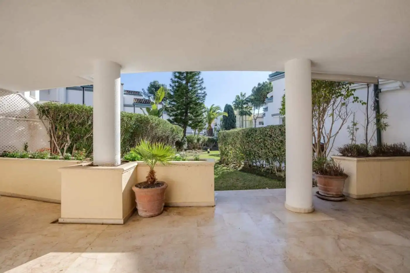 Beachfront view from a luxury property in Dominion Beach with lush gardens and modern architecture.