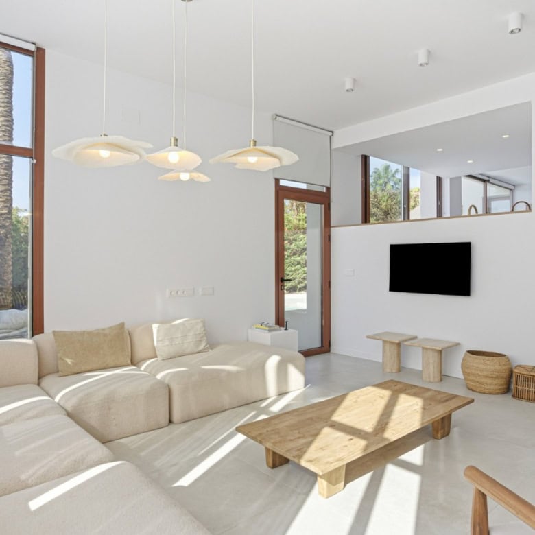 Bright and spacious living room in a stylish corner townhouse in Cancelada, Estepona, featuring larg.