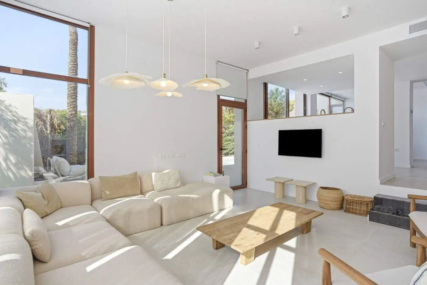 Bright and spacious living room in a stylish corner townhouse in Cancelada, Estepona, featuring larg.