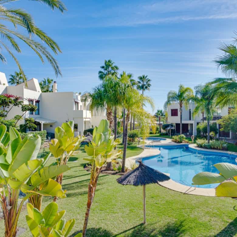 Beautiful tropical garden with pool at a luxury townhouse in Cancelada, Estepona. Perfect for relaxi.
